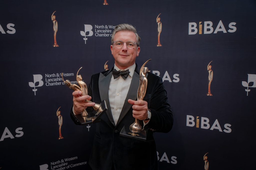 Stephen Turner holding Business of the Year, Medium Business of the Year, Scale Up Business of the Year awards at BIBAs 2026