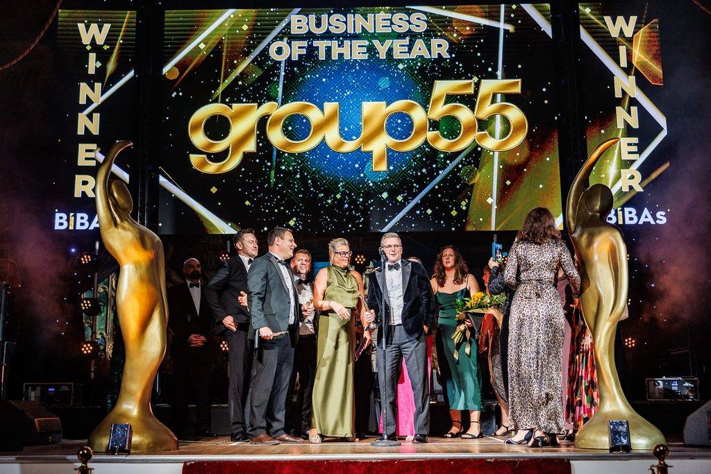 Group55 on stage receiving BIBA 2026 Business of the Year Award
